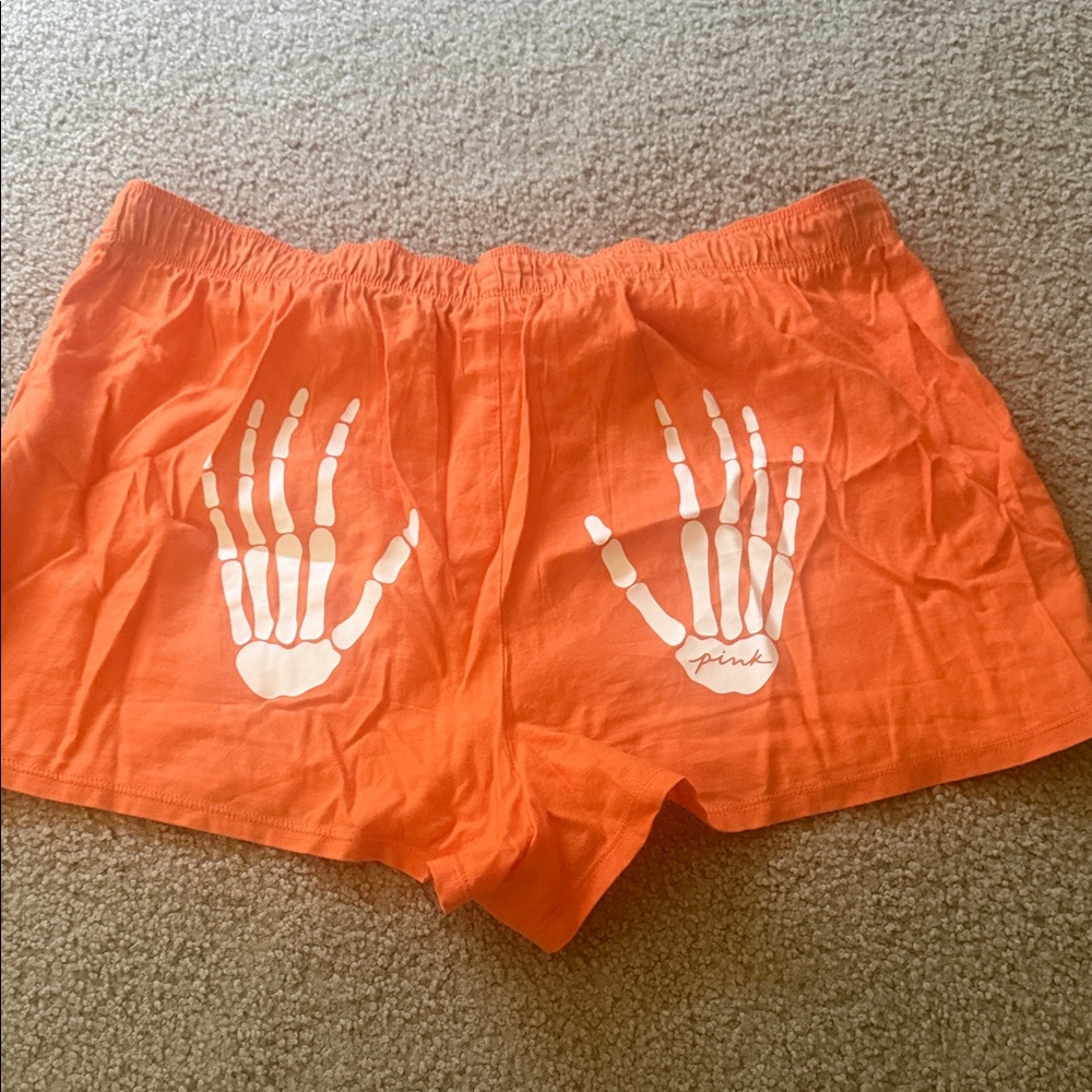 PINK Victoria's Secret Orange Cotton Shorts with White Skeleton Hand Print